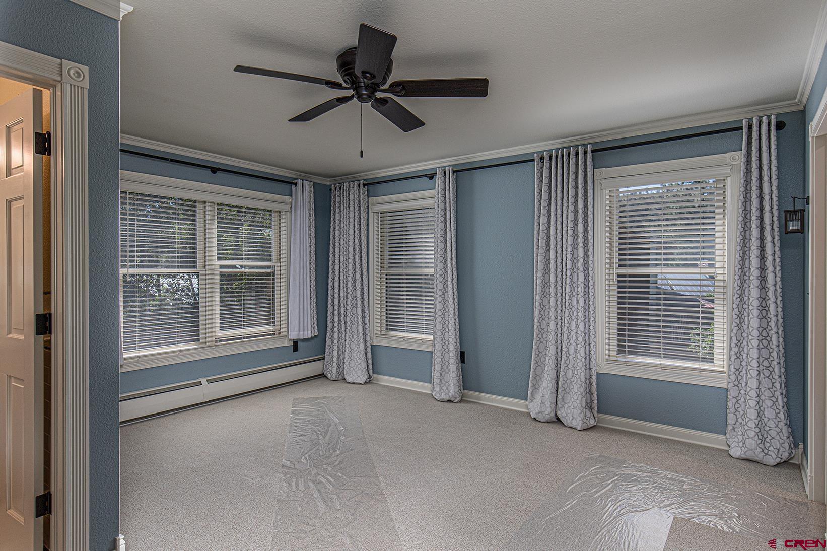 130 Hidden Treasure, Unit 1 Durango, CO 81301 - Photo 15 of 32 a view of livingroom with hardwood floor and a ceiling fan