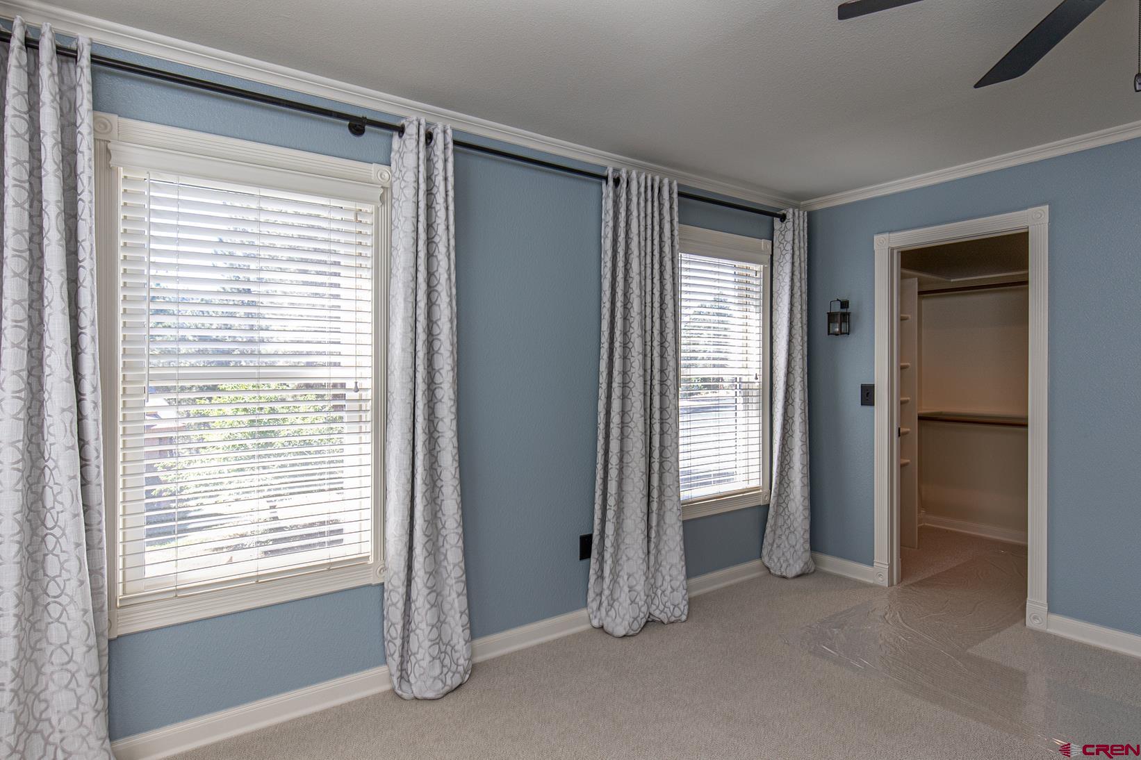 130 Hidden Treasure, Unit 1 Durango, CO 81301 - Photo 16 of 32 a view of an empty room with a window and a livingroom