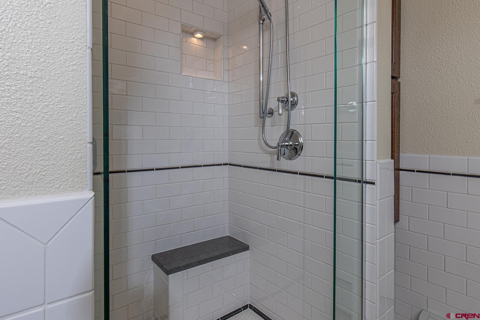 130 Hidden Treasure, Unit 1 Durango, CO 81301 - Photo 18 of 32 a bathroom with a shower