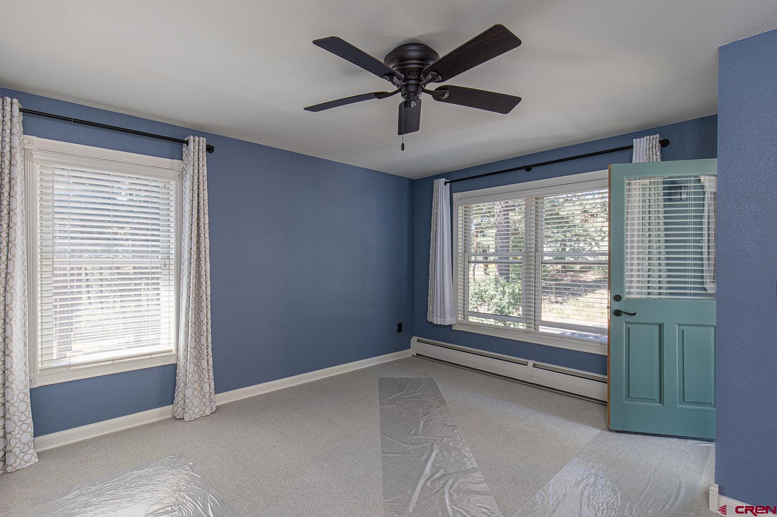 130 Hidden Treasure, Unit 1 Durango, CO 81301 - Photo 19 of 32 a view of an empty room with a window