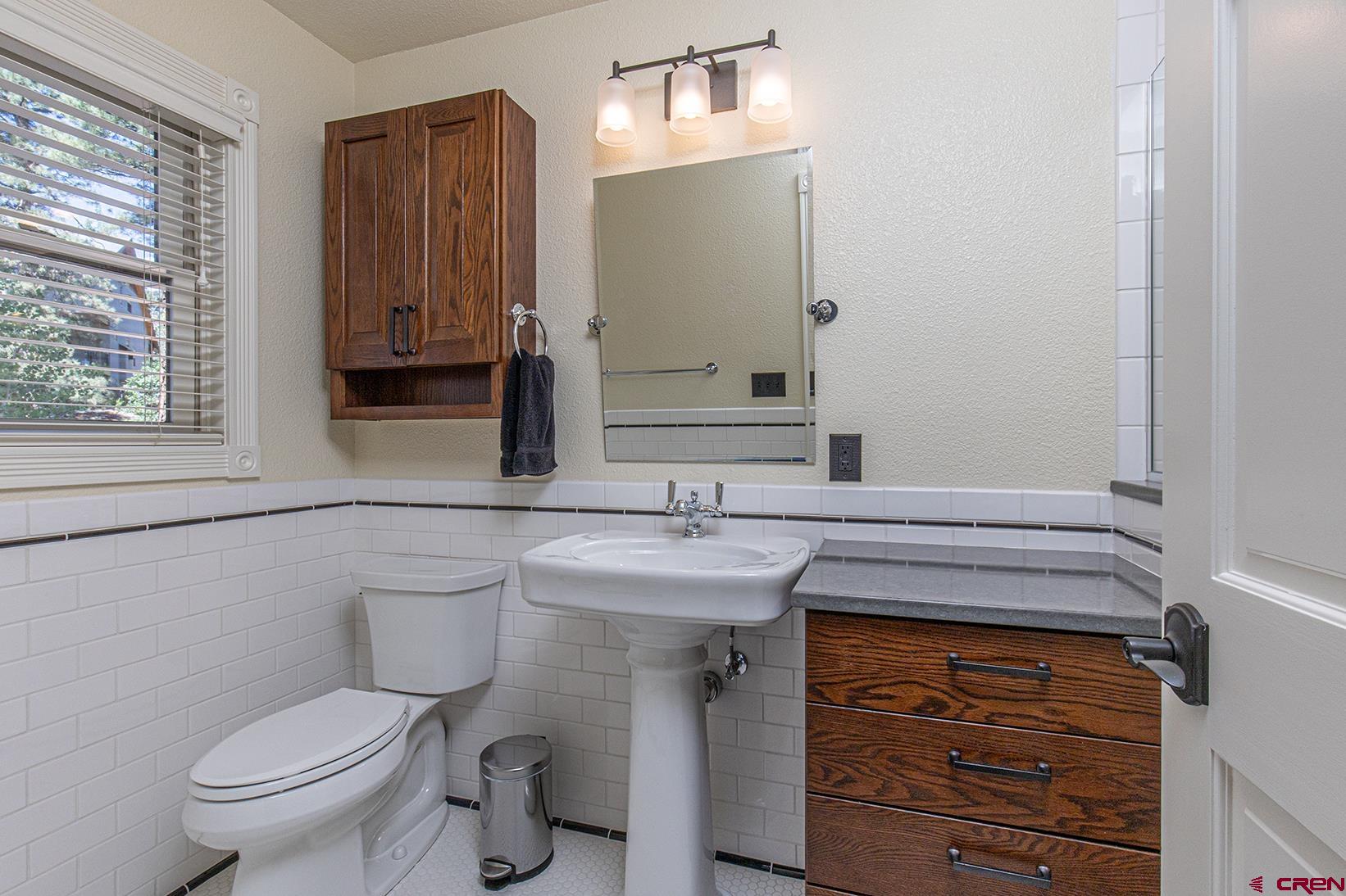 130 Hidden Treasure, Unit 1 Durango, CO 81301 - Photo 22 of 32 a bathroom with a sink and a toilet