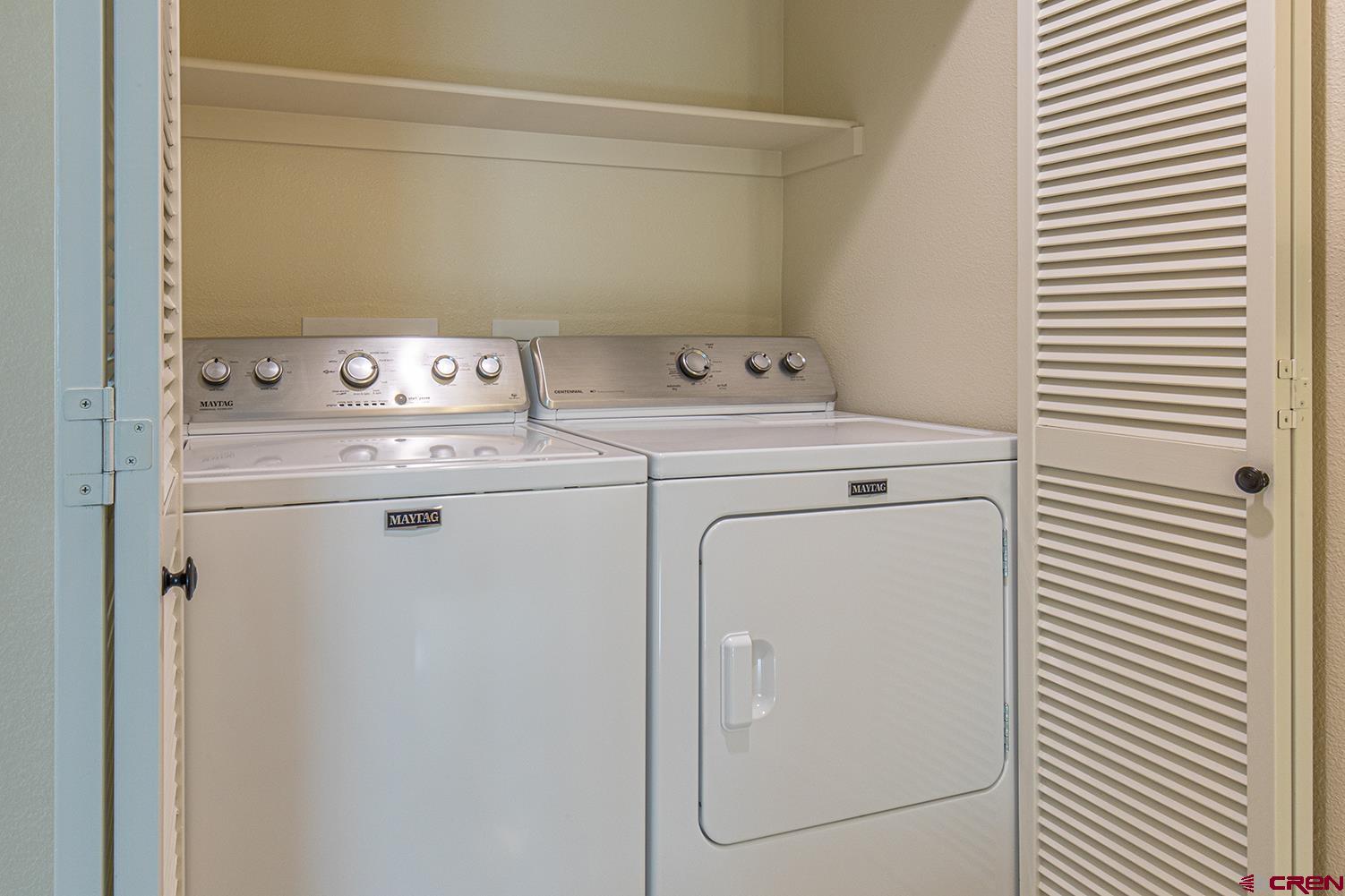 130 Hidden Treasure, Unit 1 Durango, CO 81301 - Photo 29 of 32 a utility room with dryer and washer