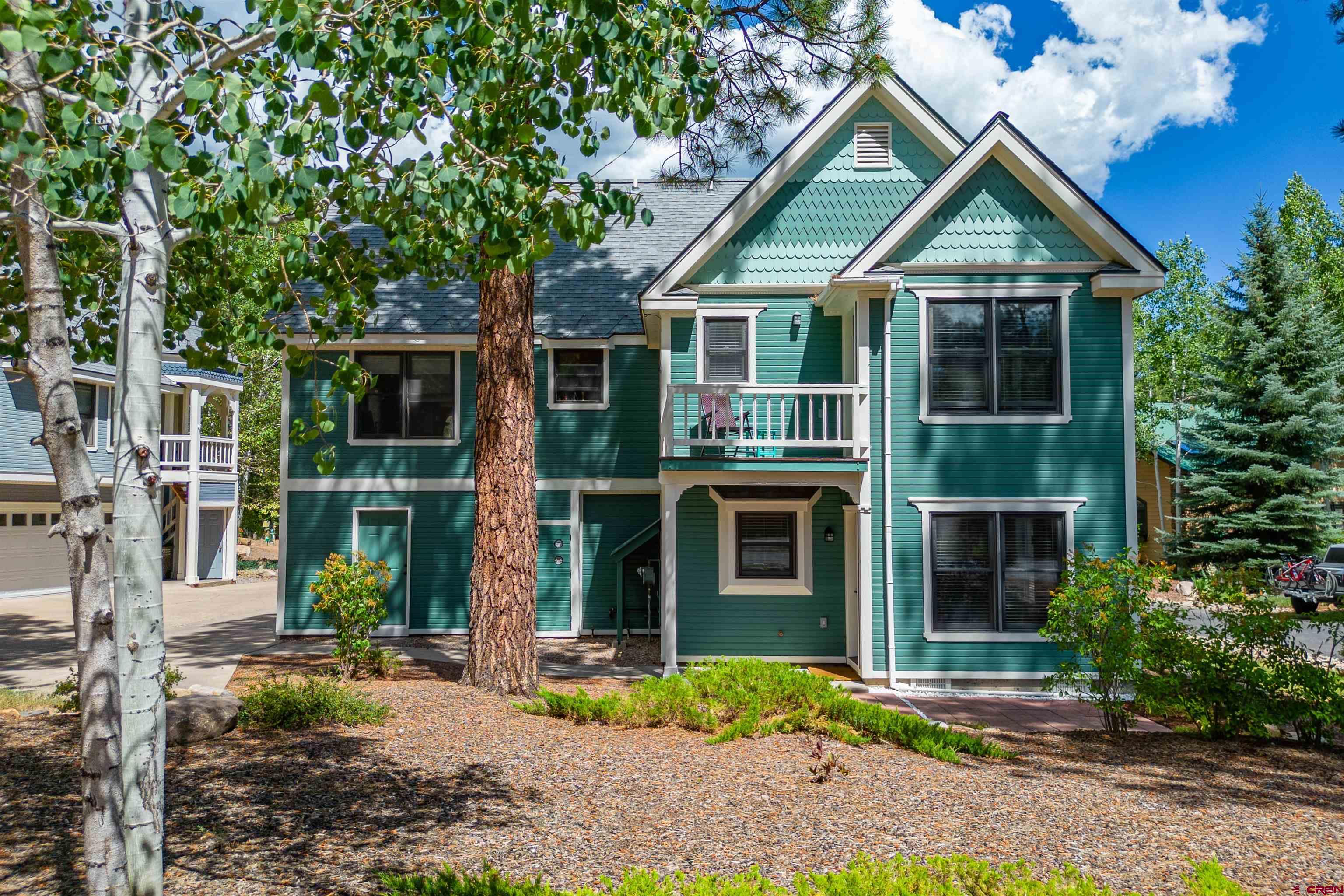 130 Hidden Treasure, Unit 1 Durango, CO 81301 - Photo 4 of 32 a front view of a house with garden