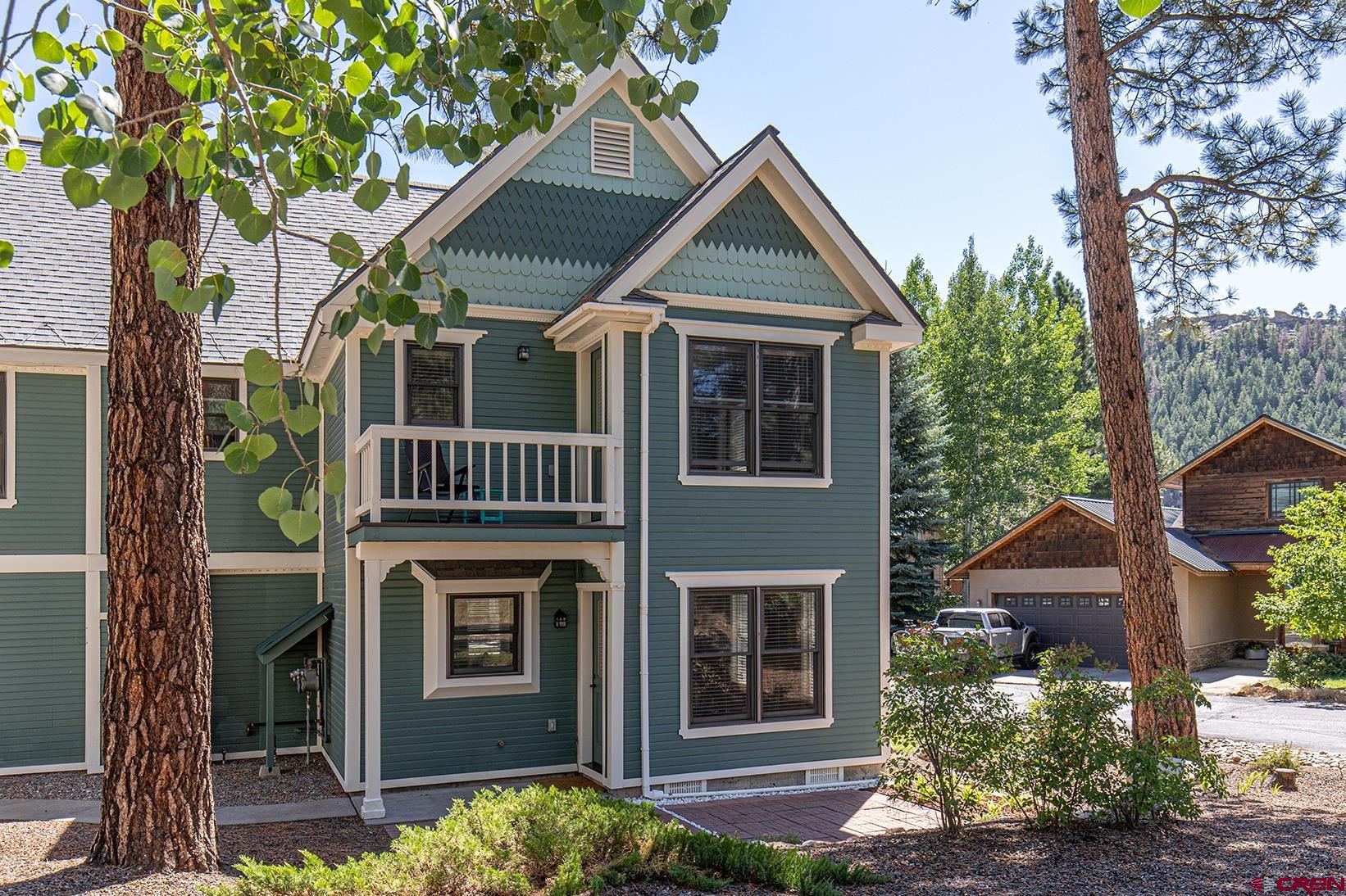 130 Hidden Treasure, Unit 1 Durango, CO 81301 - Photo 5 of 32 a front view of a house with a yard
