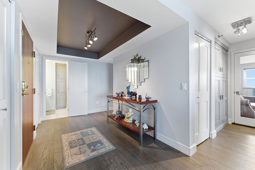 3 Seal Harbor Road, Unit 736 Winthrop, MA 02152 - Photo 12 of 41 a living room with furniture and a chandelier