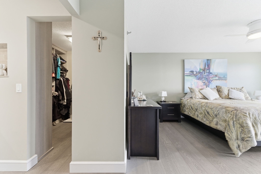 3 Seal Harbor Road, Unit 736 Winthrop, MA 02152 - Photo 17 of 41 a bedroom with a bed and a walk in closet