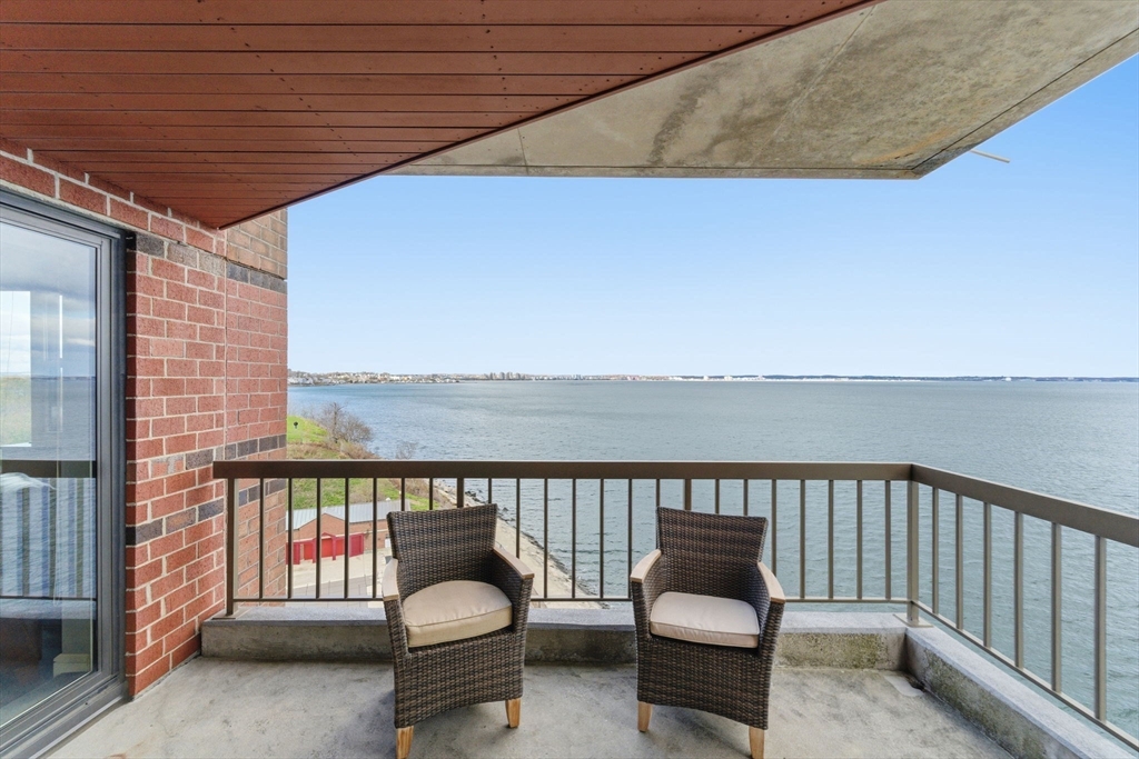 3 Seal Harbor Road, Unit 736 Winthrop, MA 02152 - Photo 3 of 41 a balcony with a table and chairs