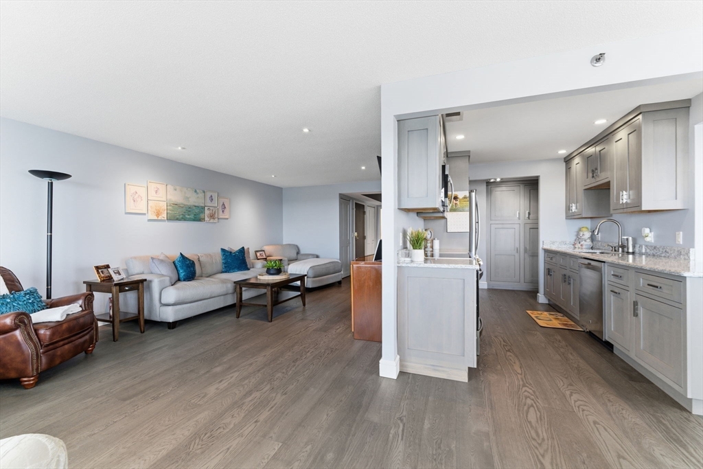 3 Seal Harbor Road, Unit 736 Winthrop, MA 02152 - Photo 8 of 41 a living room with furniture and a wooden floor