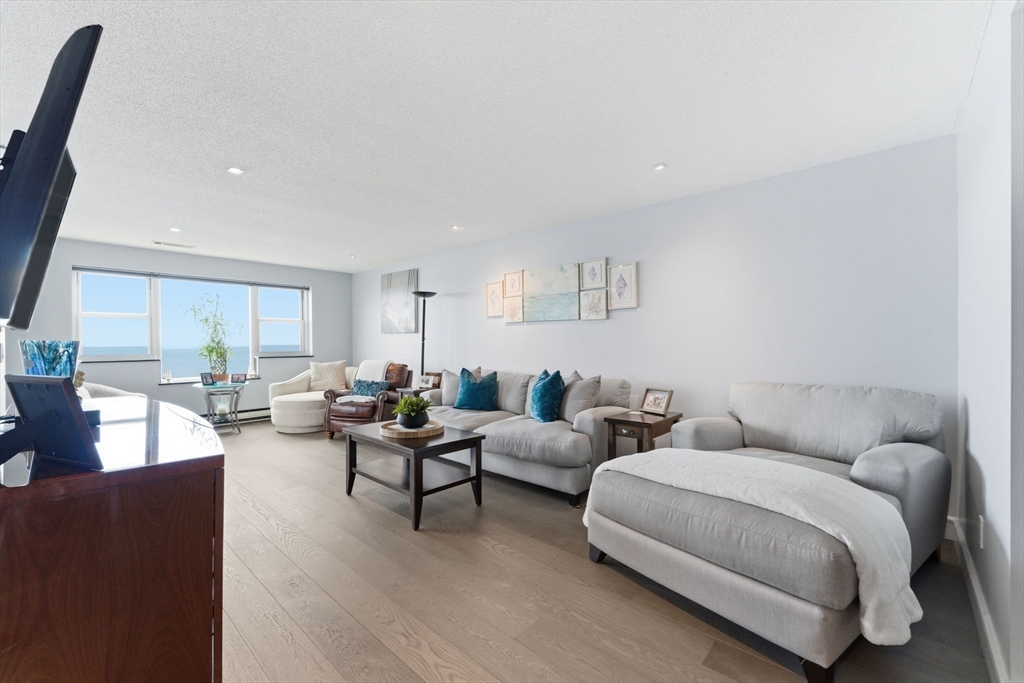 3 Seal Harbor Road, Unit 736 Winthrop, MA 02152 - Photo 9 of 41 a living room with furniture and a large window