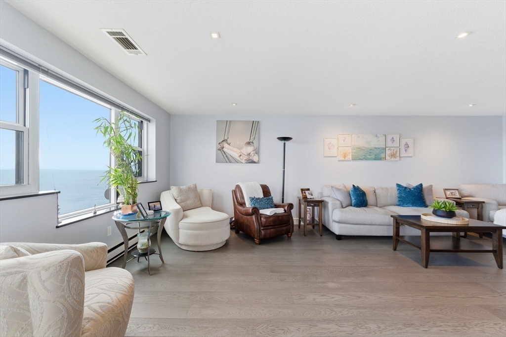 3 Seal Harbor Road, Unit 736 Winthrop, MA 02152 - Photo 10 of 41 a living room with furniture and a large window