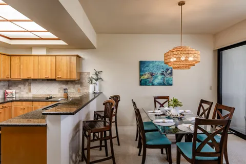 a dining room with furniture and window