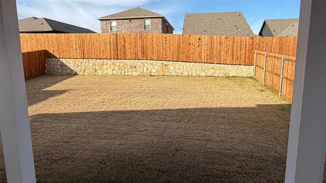 a view of room with wooden floor