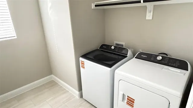 a utility room with dryer and washer