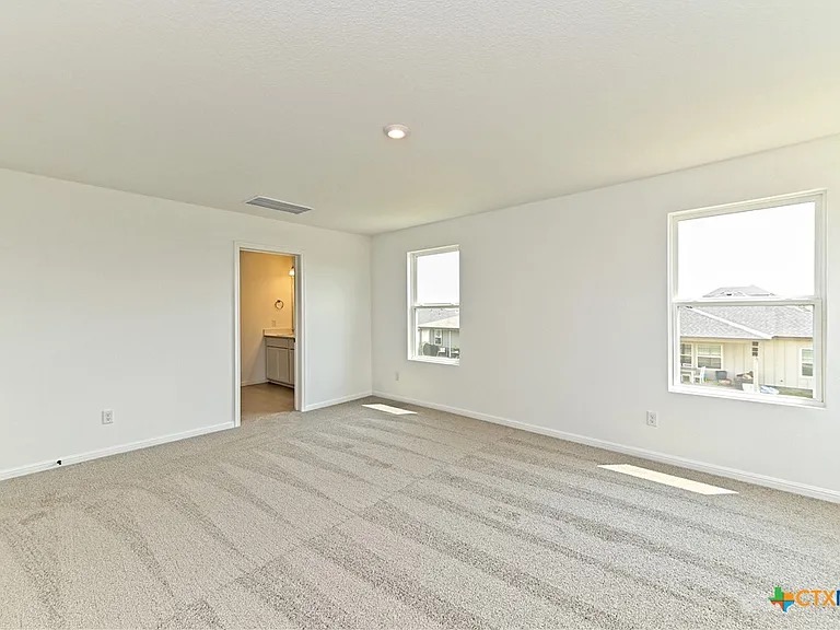 157 Seattle Slew Drive Jarrell, TX 76537 - Photo 21 of 37 Primary Bedroom