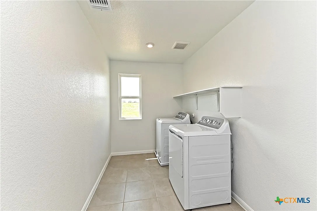 157 Seattle Slew Drive Jarrell, TX 76537 - Photo 31 of 37 Laundrytextured ceiling