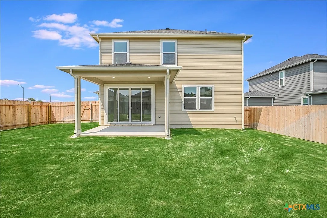 157 Seattle Slew Drive Jarrell, TX 76537 - Photo 33 of 37 Back of house with a patio area and a fenced backyard