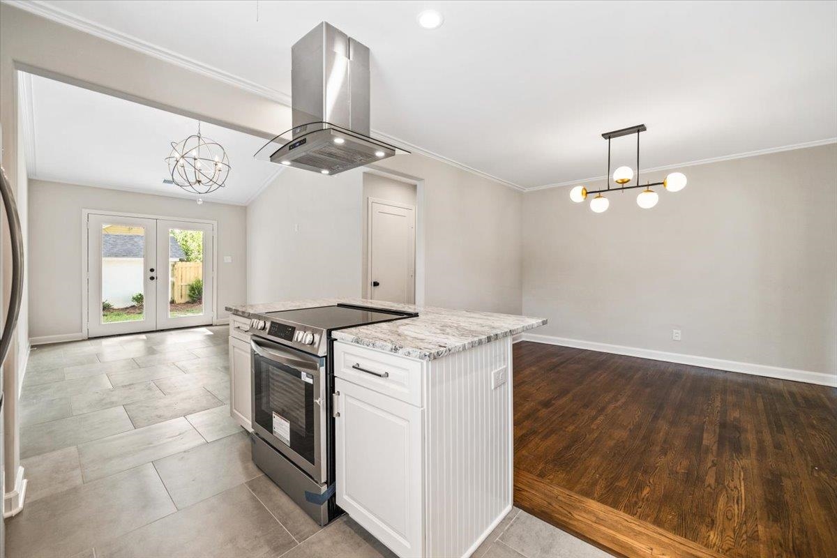 170 South Greer Street Memphis, TN 38111 - Photo 29 of 35 Kitchen island with a stainless steel range and granite countertop