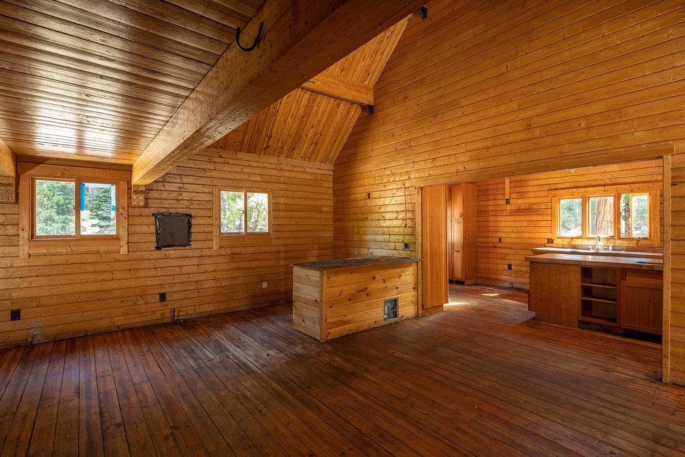 11820 Eagle Lakes Road Nevada City, CA 95959 - Photo 14 of 26 an empty room with wooden floor and windows