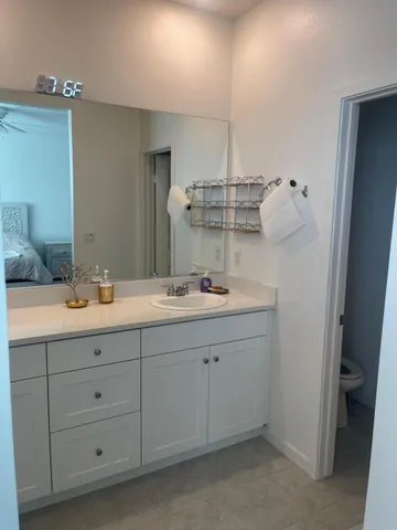 a bathroom with a double vanity sink and mirror