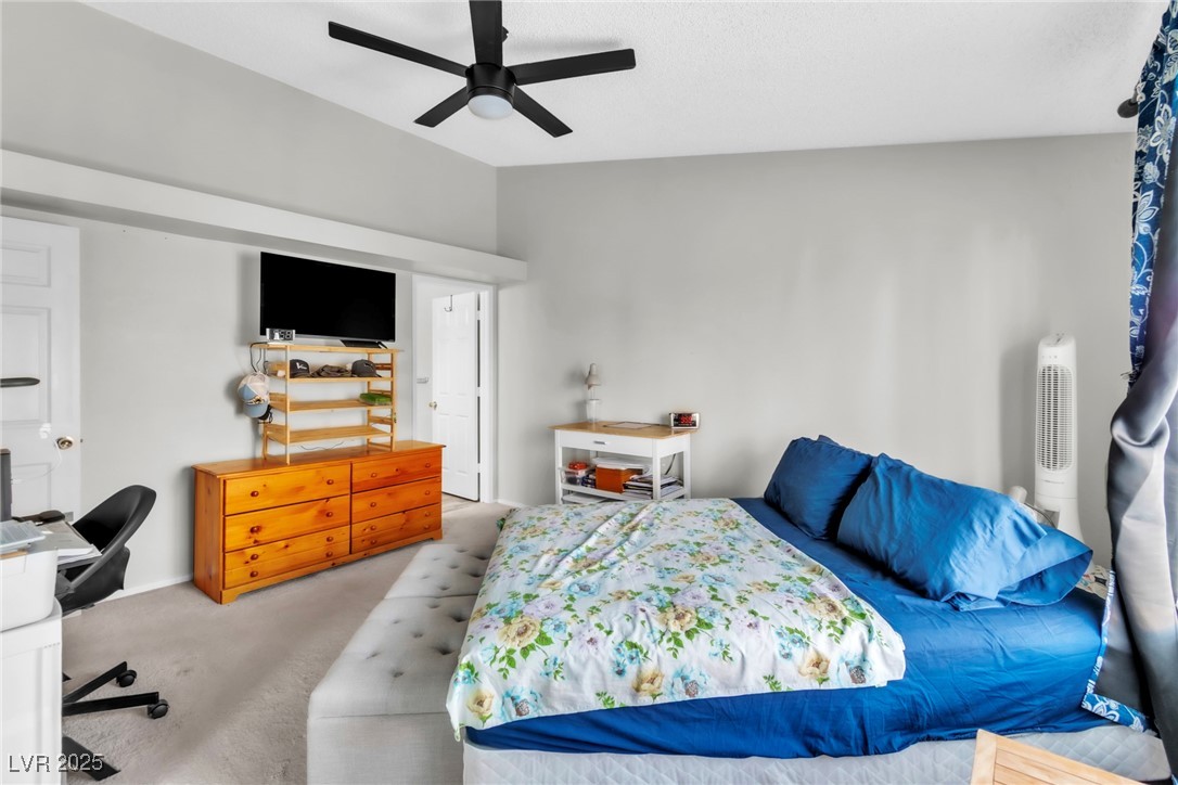 2995 East Sunset Road, Unit 235 Las Vegas, NV 89120 - Photo 12 of 24 Carpeted bedroom featuring a ceiling fan