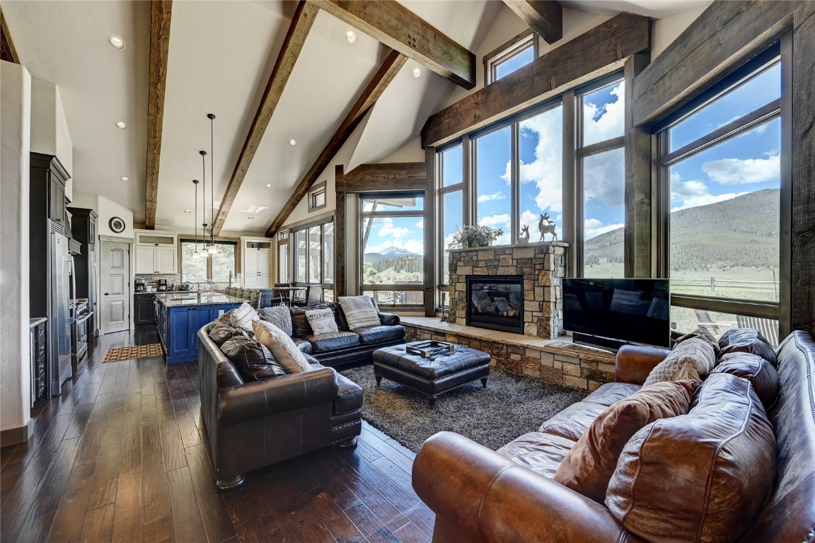 162 Penstemon Road Keystone, CO 80435 - Photo 11 of 35 a living room with furniture fireplace and a large window