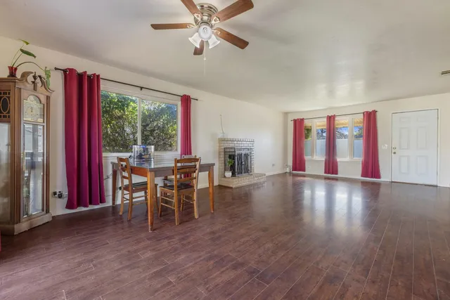 a view of a dining room with furniture window and wooden floor