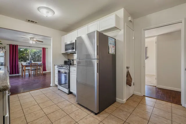 a view of a storage and utility room with cabinet