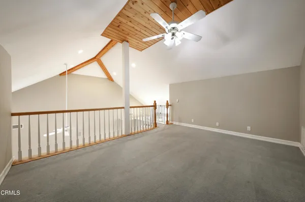 a view of a livingroom with a ceiling fan and window
