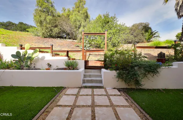 a view of a yard with an outdoor seating