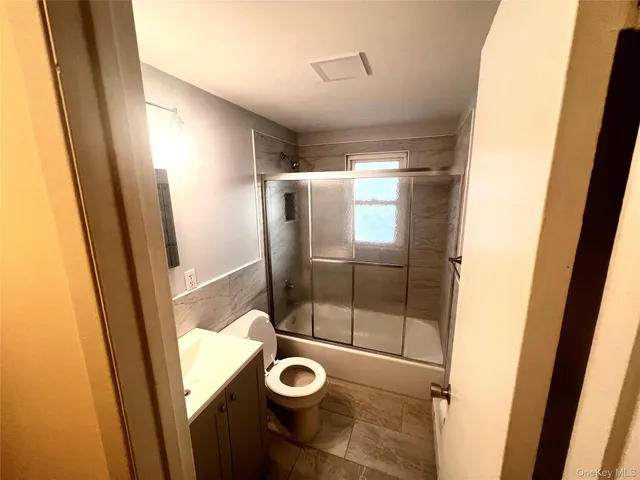 a bathroom with a shower and toilet