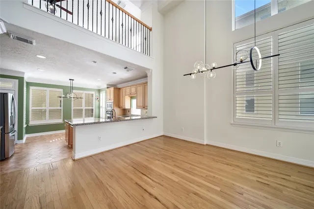 a view of a staircase with wooden floor and furniture