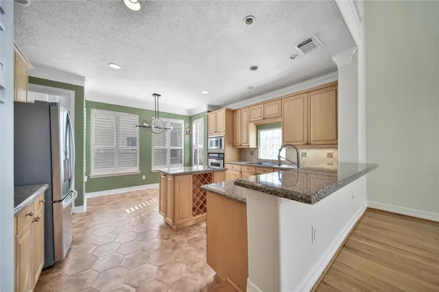 a view of a livingroom with a ceiling fan and window