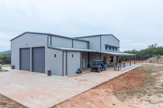 a kitchen with a stove a refrigerator and wooden floor