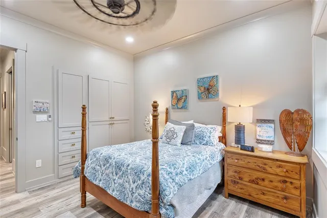 a bathroom with a granite countertop sink a toilet a mirror and shower