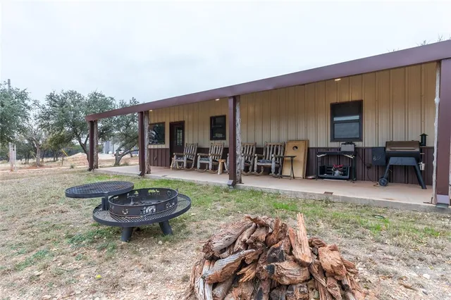 a house that has a tree in front of it