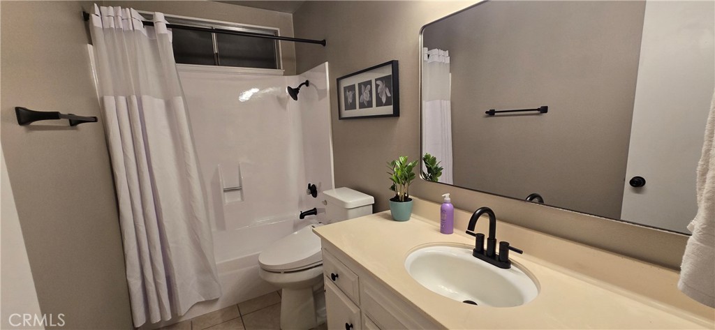 6830 Astoria Drive Riverside, CA 92503 - Photo 21 of 23 a bathroom with a sink toilet and shower