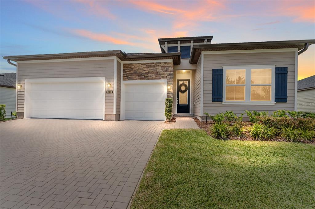 front view of a house with a yard