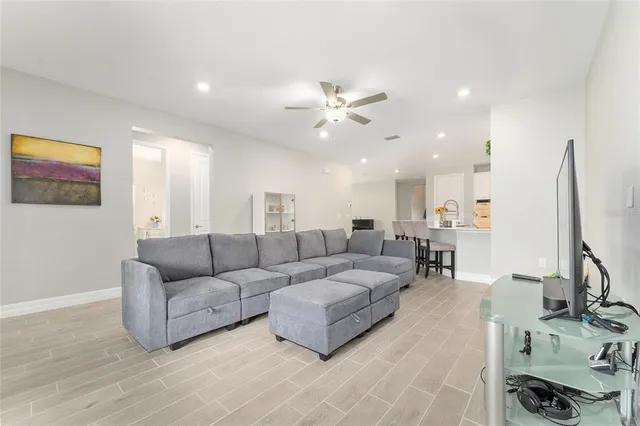 a view of a hallway with a potted plant on a table
