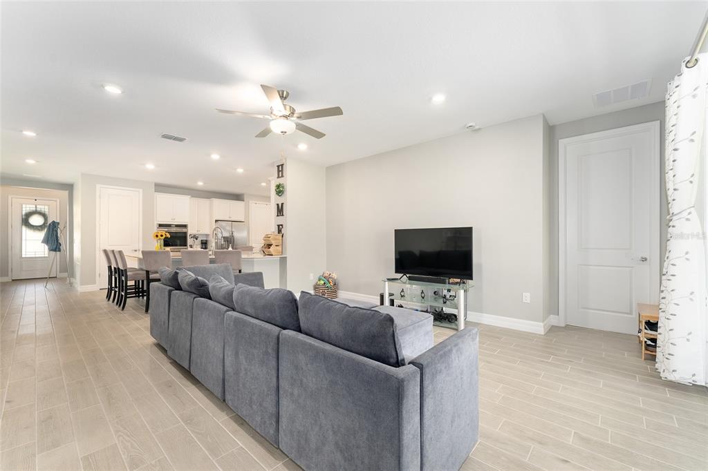 1244 Southeast 42nd Road Ocala, FL 34480 - Photo 14 of 56 a living room with furniture and a flat screen tv