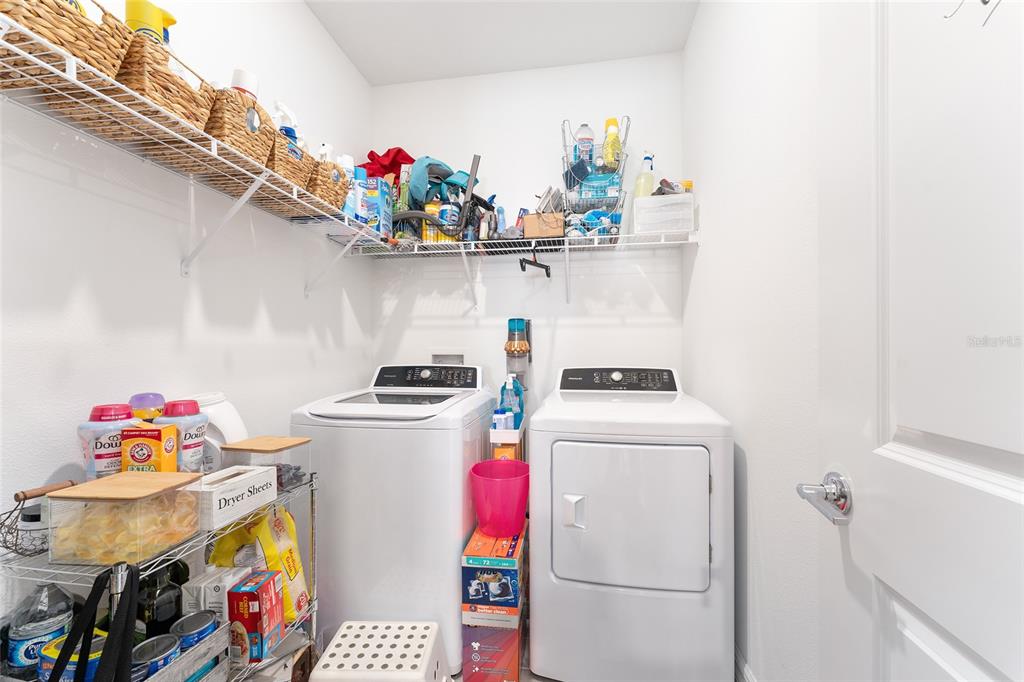 1244 Southeast 42nd Road Ocala, FL 34480 - Photo 17 of 56 a utility room with dryer and washer