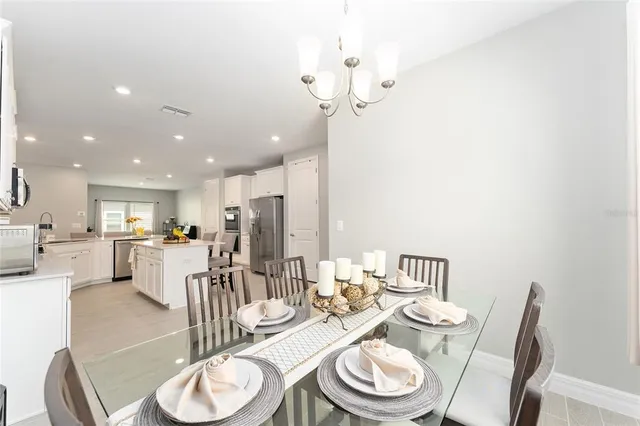 a view of a dining room with furniture window and outside view
