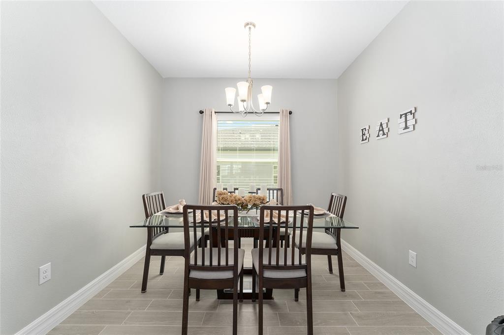 1244 Southeast 42nd Road Ocala, FL 34480 - Photo 20 of 56 a view of a dining room with furniture window and outside view