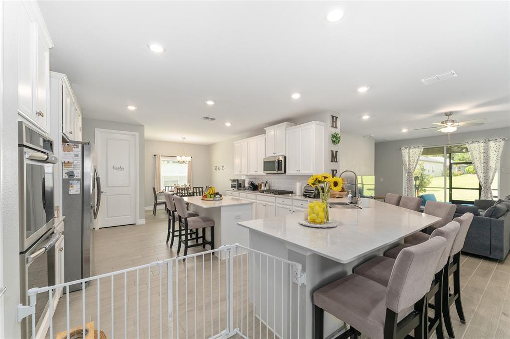 1244 Southeast 42nd Road Ocala, FL 34480 - Photo 27 of 56 a kitchen with a table and chairs