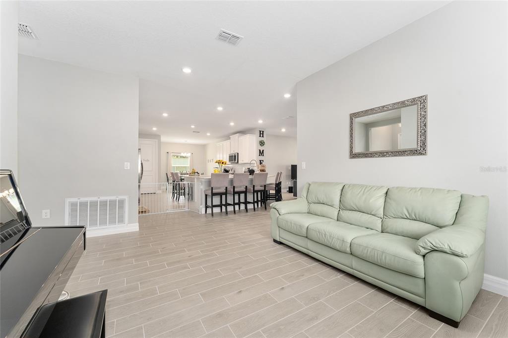 1244 Southeast 42nd Road Ocala, FL 34480 - Photo 30 of 56 a living room with furniture and kitchen view