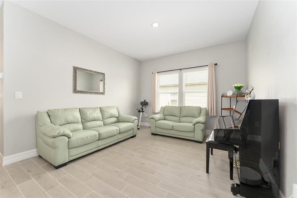 1244 Southeast 42nd Road Ocala, FL 34480 - Photo 33 of 56 a living room with furniture and a window