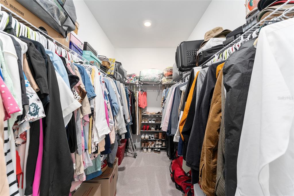 1244 Southeast 42nd Road Ocala, FL 34480 - Photo 38 of 56 a view of walk in closet with clothes