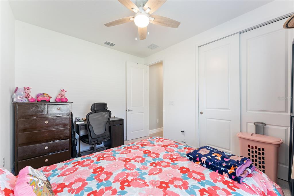 1244 Southeast 42nd Road Ocala, FL 34480 - Photo 53 of 56 a bedroom with a bed and a dresser