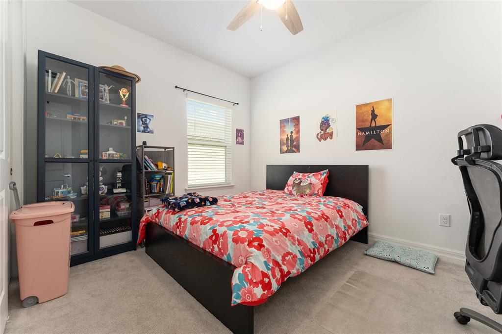 1244 Southeast 42nd Road Ocala, FL 34480 - Photo 54 of 56 a bedroom with a bed dresser and a window