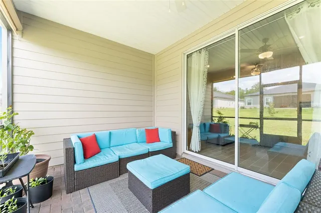 a living room with couch and a window