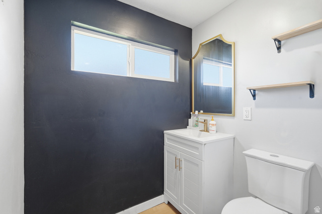 2500 North Fort Lane, Unit 220 Layton, UT 84041 - Photo 12 of 23 Vanity with white shaker-style cabinetry and gold-tone hardware, a white rectangular sink, and gold-finish faucet